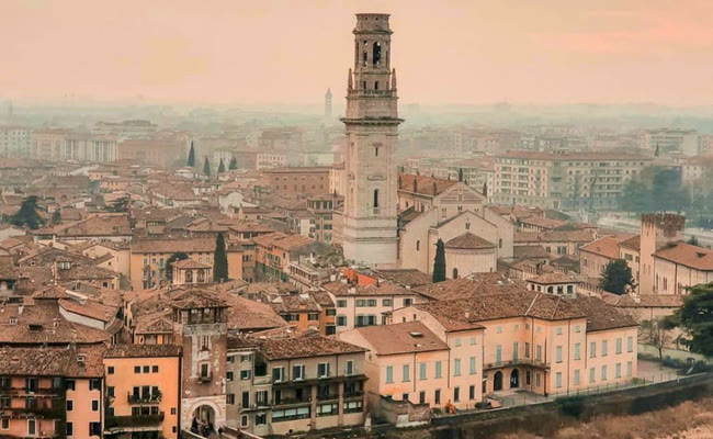 The Duomo bell tower and the rooftops of Verona seen from the hill above Ponte Pietra